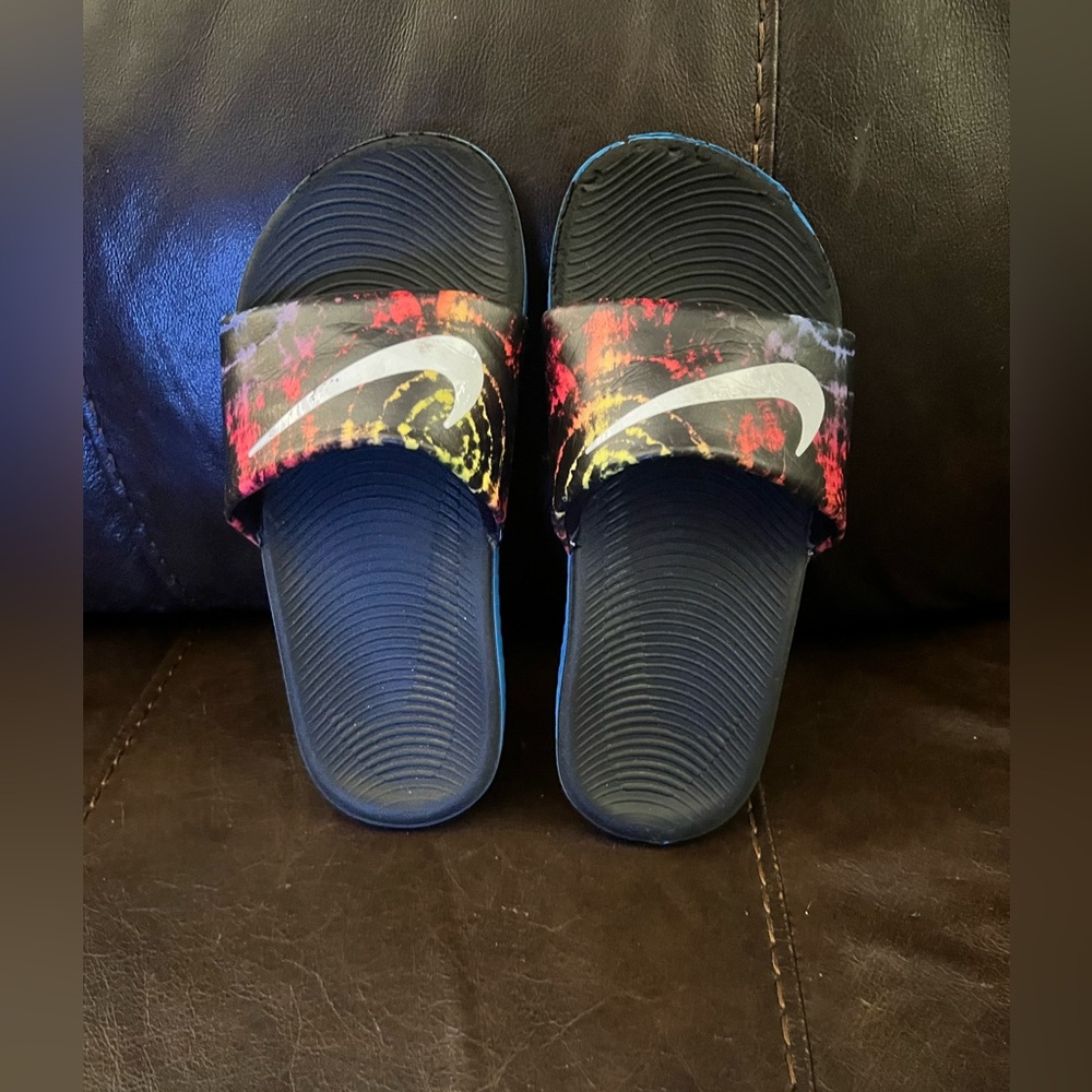 Size 2 boys Nike slides. A little worn.